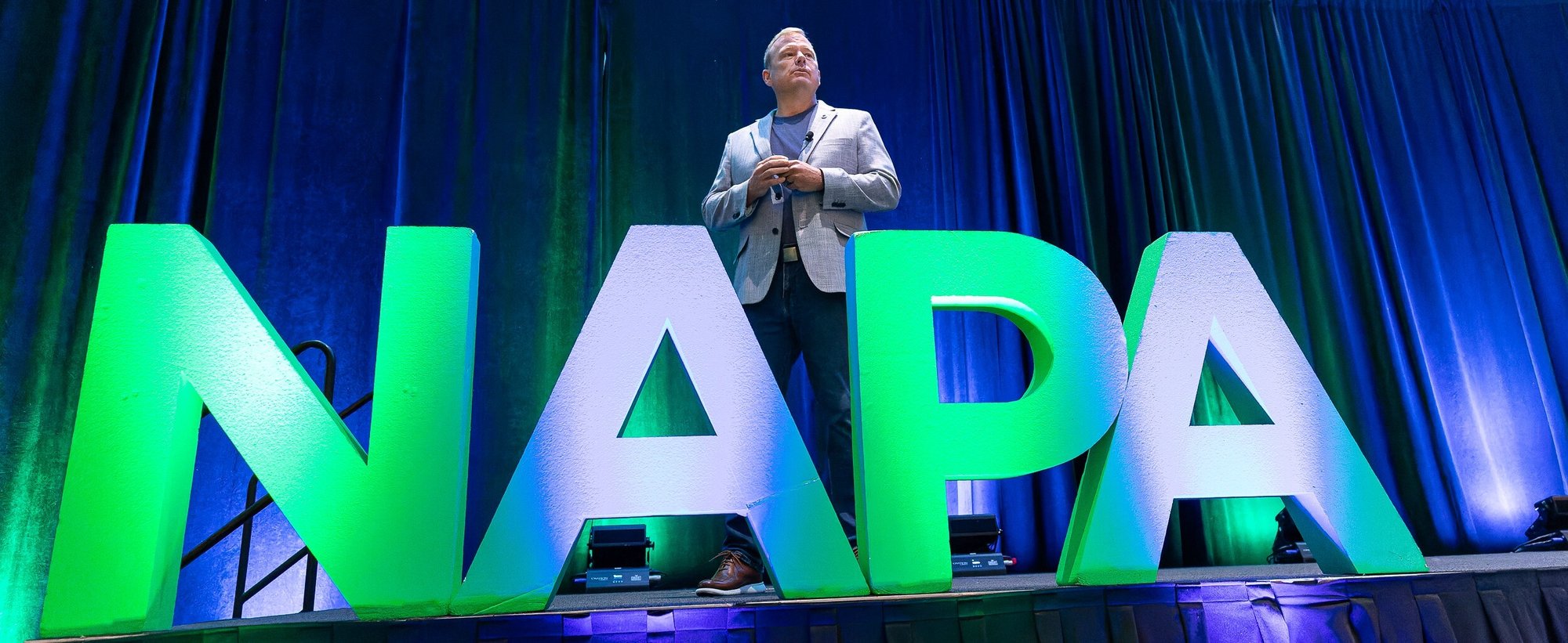 NAPA sign and speaker on stage NAPA sign and speaker on stage